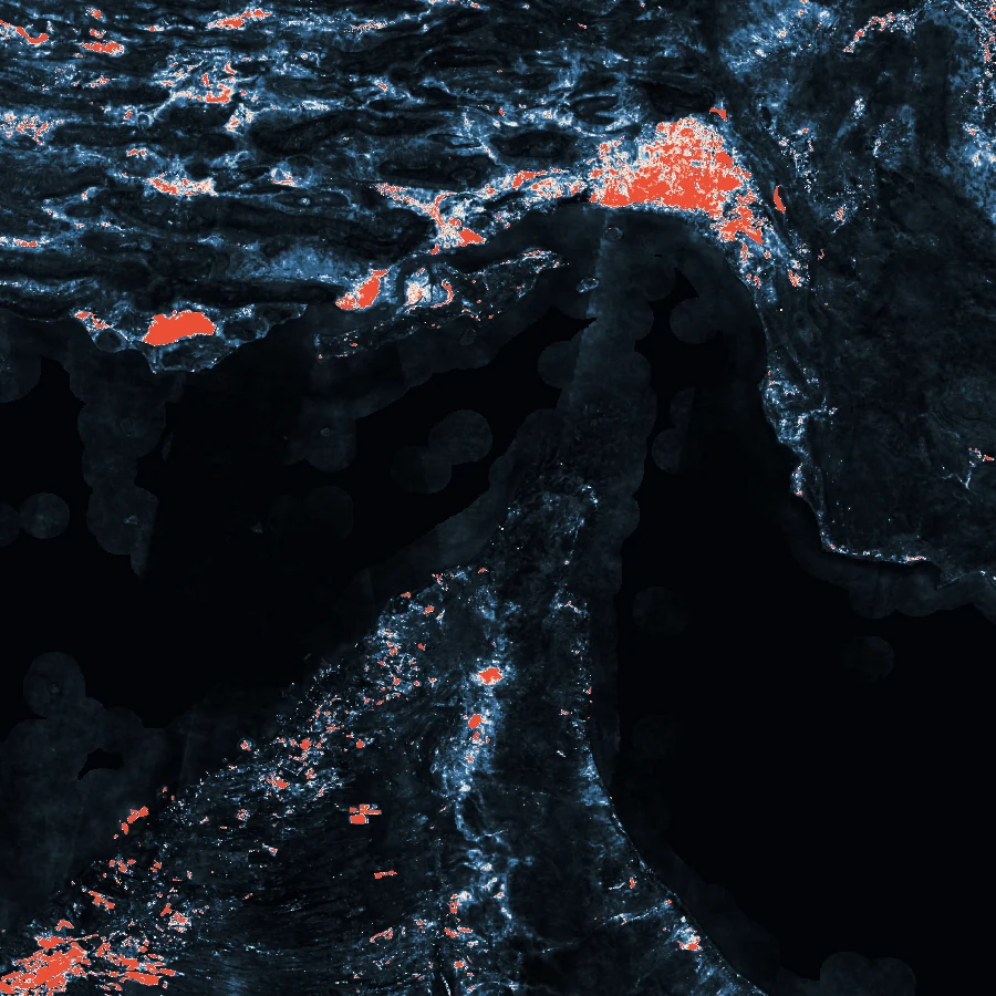 Embedding-space change field over the Strait of Hormuz: cosine distance between the 2022 and 2025 64-dimensional embeddings, with the strongest change in signal red